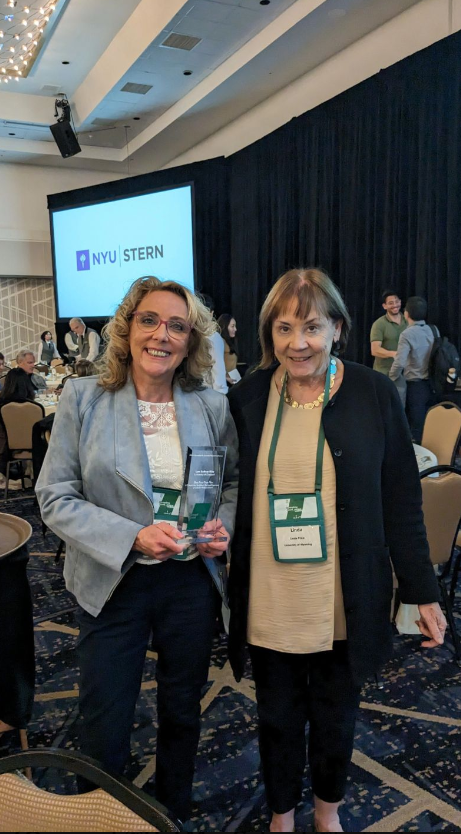 Lynn Sudbury Riley holding her award