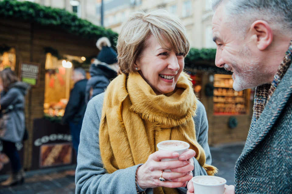 Mature couple enjoy a cup of coffee together